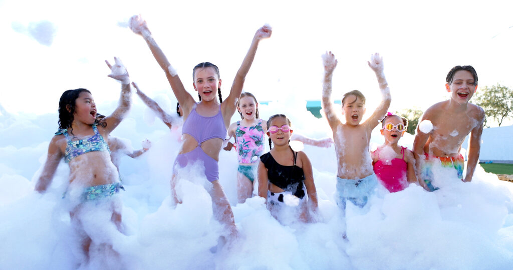 freddy frog's foam party waving kids