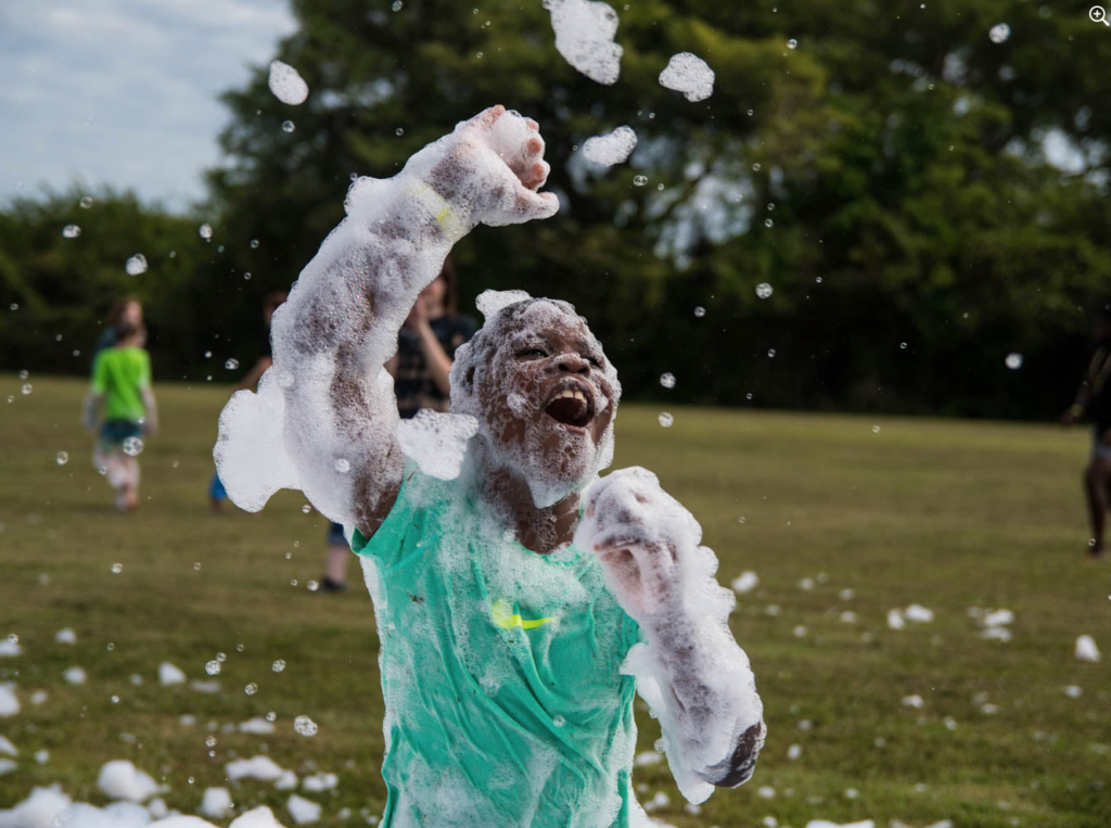 freddy frog's foam party smiling boy